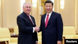 Chinese President Xi Jinping shakes hands with U.S. Secretary of State Rex Tillerson before their meeting at at the Great Hall of the People, March 19, 2017, in Beijing, China.