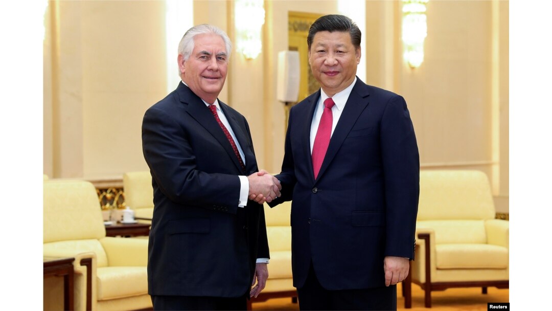 FILE - Chinese President Xi Jinping shakes hands with U.S. Secretary of State Rex Tillerson before their meeting at at the Great Hall of the People in Beijing, China, March 19, 2017.