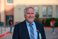 Albuquerque Public Schools superintendent Scott Elder poses for a photo outside of Highland High School, in Albuquerque, New Mexico, Aug. 11, 2021.