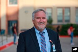 Albuquerque Public Schools superintendent Scott Elder poses for a photo outside of Highland High School, in Albuquerque, New Mexico, Aug. 11, 2021.