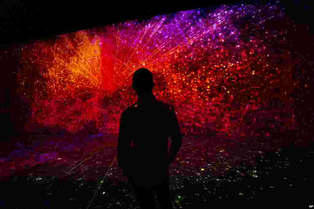 A visitor watches a projection at the TelcoDR booth during the Mobile World Congress 2021 in Barcelona, Spain.