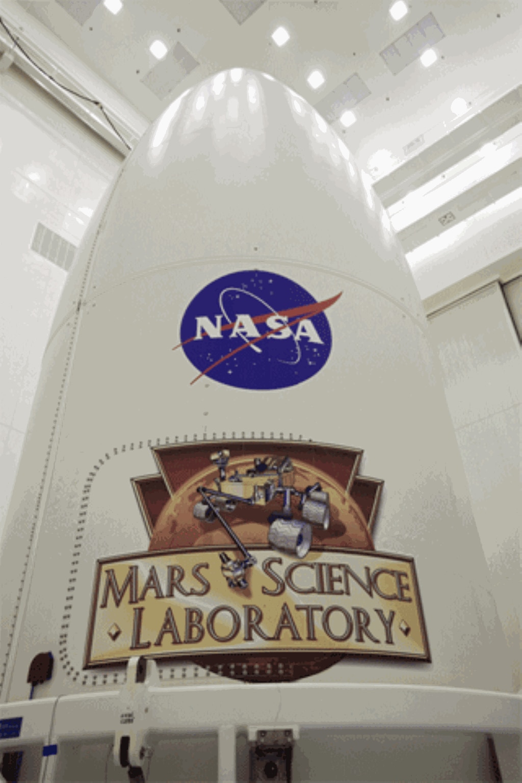 At NASA's Kennedy Space Center in Florida, an Atlas V rocket's payload container bears the NASA logo above the Mars Science Laboratory (MSL) logo. (NASA Rover)