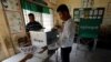 Election workers assemble a polling booth inside a classroom at a school in Phnom Penh, Cambodia, July 28, 2018. Cambodians head to the polls Sunday.
