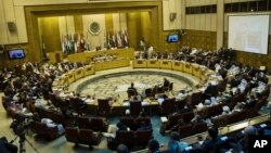 FILE - Representatives of Arab League countries are seen meeting at the group's headquarters in Cairo, Egypt. 