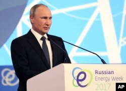President Vladimir Putin speaks at the Russian Energy Week Energy Efficiency and Energy Development International Forum in Moscow, Oct. 4, 2017.
