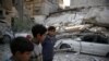 Trump, May Blame Syria, Russia for Eastern Ghouta Humanitarian Woes
