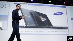 Sundar Pichai, VP of Product Management for Google, displays a Samsung notebook running on the Chrome operating system at the Google IO Developers Conference in San Francisco, May 11, 2011.