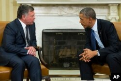 President Barack Obama, right, meets with King Abdullah II of Jordan in the Oval Office of the White House, Feb. 3, 2015, in Washington.