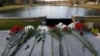 Flowers honoring the victims that died a day earlier when a gunman opened fire at an elementary school lay on a bridge in Newtown, Conn., Dec. 15, 2012. 