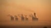 FILE - Steam rises at sunrise from the Lethabo Power Station, a coal-fired power station owned by state power utility ESKOM near Sasolburg, South Africa, March 2, 2016. 