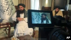 The foreign minister in Afghanistan's new Taliban-run Cabinet, Amir Khan Muttaqi speaks during an interview to the Associated Press in Kabul, Afghanistan, Sunday, Dec. 12, 2021. (AP Photo/Mohammed Shoaib Amin)