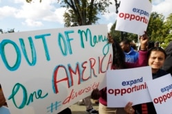 Students calling for diversity protest outside the U.S. Supreme Court in Washington October 10, 2012.