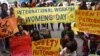 Demonstrators at the International Women's Day rally stage a sit-down protest outside Trump International Hotel at Columbus Circle, March 8, 2017, in New York.