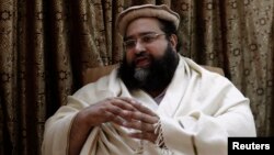 FILE - Muhammad Tahir Ashrafi, head of the powerful Ulema Council of clerics, speaks during an interview with Reuters in Islamabad.