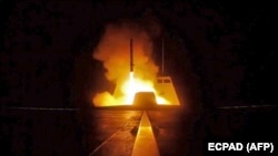 Mediterranean sea -- A picture released by the French Defence audiovisual communication and production unit (ECPAD) shows the launching of a cruise missile from a French military vessel in the Mediterranean sea towards targets in Syria overnight April 13