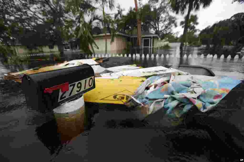 Floodwaters surround a mailbox in the aftermath of Hurricane Irma in Bonita Springs, Florida, Sept. 11, 2017.