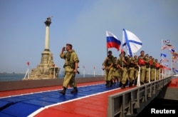 Russian marines parade during the Navy Day celebrations in Sevastopol, Crimea, July 31, 2016.