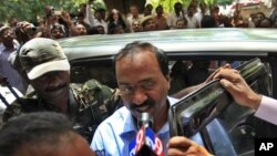 Karnataka state lawmaker and former minister G. Janardhan Reddy, center, is brought to the Central Bureau of Investigation (CBI) office after he was arrested in Hyderabad, India, Monday, Sept. 5, 2011