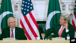 Secretary of State John Kerry and Pakistan Foreign Affairs Adviser Sartaj Aziz participate in the U.S.-Pakistan Strategic Dialogue meeting at the State Department in Washington, Feb. 29, 2016.