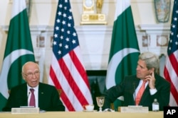 FILE - Secretary of State John Kerry and Pakistan Foreign Affairs Adviser Sartaj Aziz, participate in the U.S.-Pakistan Strategic Dialogue meeting at the State Department in Washington, Feb. 29, 2016.