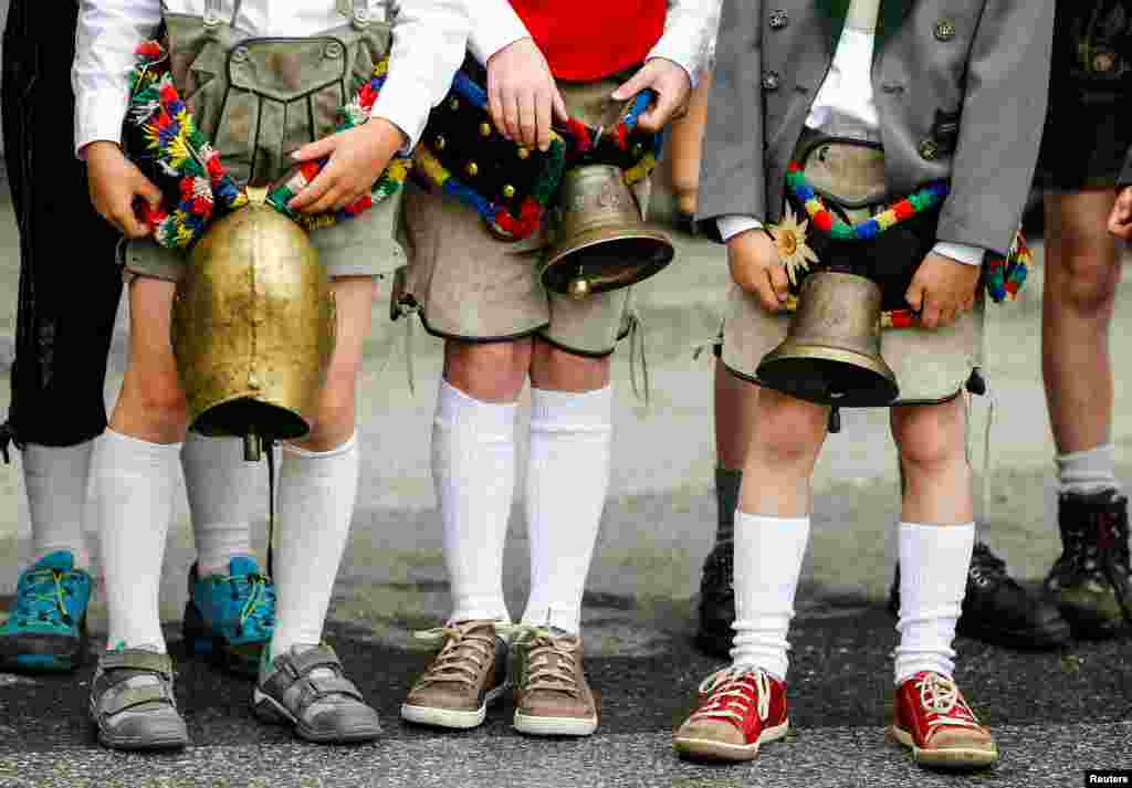 Children in traditional Tyrolean clothes attend a parade at the annual Gauner Festival in Zell am Ziller, Austria.