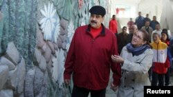 Venezuela's President Nicolas Maduro and his wife, Cilia Flores, inspect the rebuilding of the Humboldt Hotel, a state-run hotel, at the Avila mountain in Caracas, Venezuela, Dec. 7, 2017.