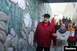 Venezuela's President Nicolas Maduro and his wife, Cilia Flores, inspect the rebuilding of the Humboldt Hotel, a state-run hotel, at the Avila mountain in Caracas, Venezuela, Dec. 7, 2017.