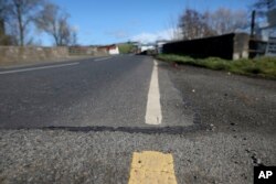 A view of the Irish border near the town of Middletown, Northern Ireland, March, 12, 2019. All that makes the border crossing visible is the change in paint on the road markings and the cut in the tarmac, with white paint being in Northern Ireland and yellow paint used in the Republic of Ireland.