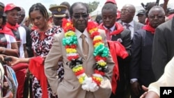 FILE: Zimbabwean President Robert Mugabe is seen during celebrations to mark his 89th birthday in Bindura about 100 kilometres north of Harare, Saturday, March, 2, 2013. 
