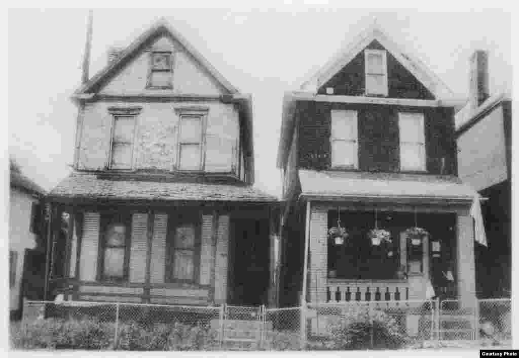 This is a familiar sight in Braddock, Pennsylvania, two houses side by side, one occupied, one vacant. (George L. Smyth)