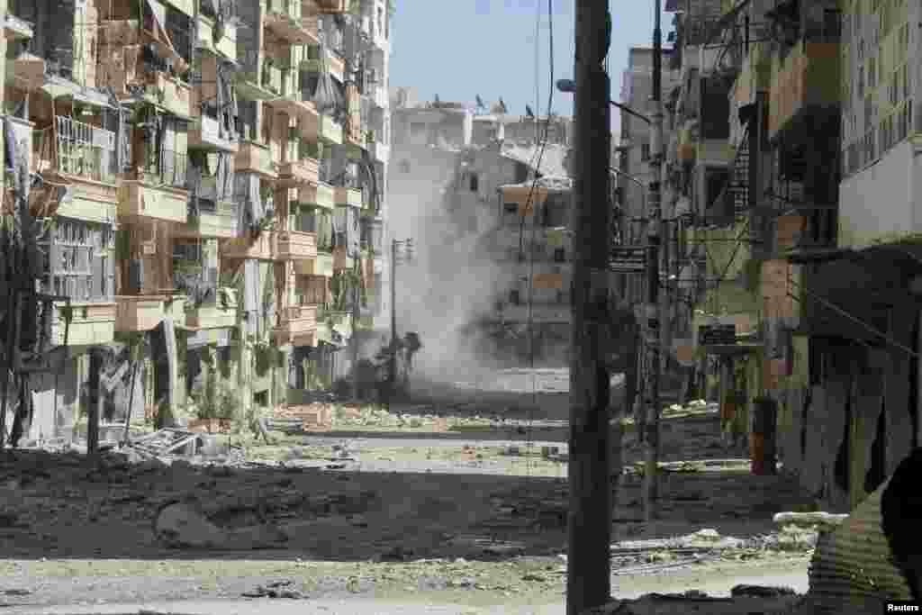 A view of a street filled with rubble and damaged buildings in Aleppo's Salaheddine neighborhood, April 28, 2013. 