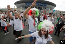 Iranian fans dance in front of Saint Petersburg stadium prior the group B match between Morocco and Iran at the 2018 soccer World Cup in St. Petersburg, Russia, June 15, 2018.