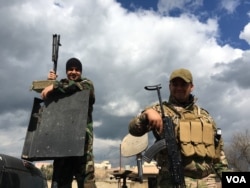 Two fighters of the Dwekh Nawsha Christina militia protecting traditional Christian lands from IS extremists. Although under equipped, the Kurdish Peshmerga are nearby and they are determined to stay. (S. Behn/VOA)