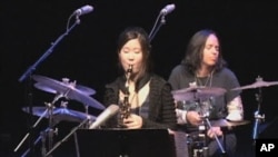 Jazz saxophone player Grace Kelly (center) on stage