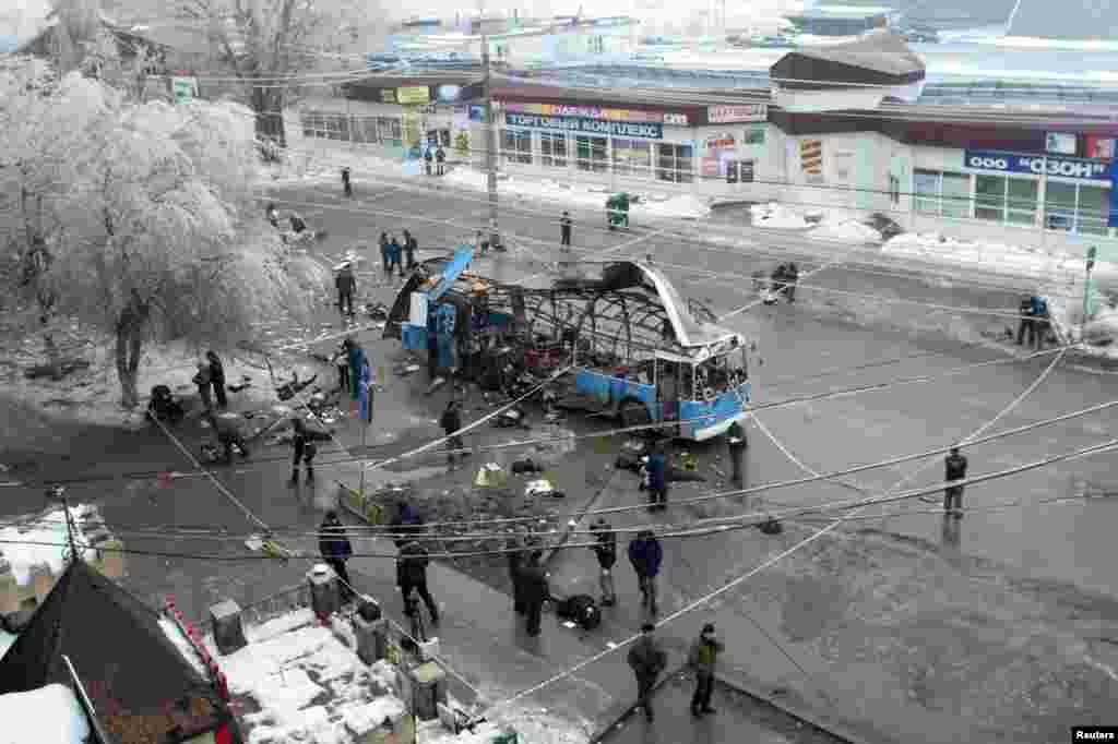 Investigators work at the site of a blast on a bus in Volgograd, Russia, Dec. 30, 2013.