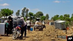 People who fled Daraa province gather in the Quneitra countryside, near the Israeli-occupied Golan Heights, July 5, 2018, in this photo provided by Nabaa Media, a Syrian opposition media outlet.