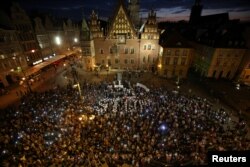 People attend a protest against judicial overhaul in Wroclaw, Poland, July 26, 2018.