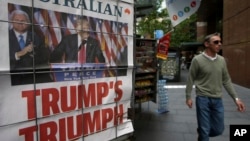 A man walks past a newspaper placard showing U.S. President-elect Donald Trump, in Sydney, Australia, Nov. 10, 2016. Reacting to Trump's election victory, Australian PM Malcolm Turnbull said that the relationship between the two countries "will continue to be strong."