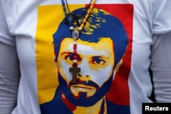 FILE - An image of jailed opposition leader Leopoldo Lopez is seen on his wife Lilian Tintori's T-shirt.