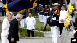 Japan's Emperor Akihito and Empress Michiko bow before the monument of Dr. Jose P. Rizal, the country's National Hero, during a wreath-laying ceremony Wednesday, Jan. 27, 2016 in Manila, Philippines.