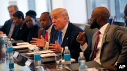 Republican presidential candidate Donald Trump holds a roundtable meeting with the Republican Leadership Initiative in his offices at Trump Tower in New York, Aug. 25, 2016. Dr. Ben Carson is seated next to Trump at center.