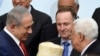 Obsèques de Peres : poignée de main Netanyahu/Abbas, vif débat chez les Palestiniens