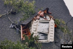 A damaged house is seen after Tropical Storm Florence struck in Winnabow, N.C., Sept. 15, 2018.
