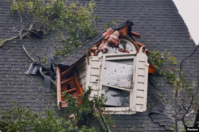 A damaged house is seen after Tropical Storm Florence struck in Winnabow, N.C., Sept. 15, 2018.