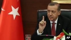 Turkish Prime Minister Tayyip Erdogan speaks to the media in his office in Ankara, Turkey, April 23, 2014.