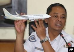 FILE - National Transportation Safety Committee investigator Nurcahyo Utomo during a press conference on the committee's preliminary findings on their investigation on the Lion Air crash, in Jakarta, Nov. 28, 2018.