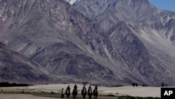 Tourists in Ladakh, India. The heavily militarized region also borders China, and is at the center of a long-running dispute between the two countries.