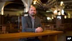 Hofbraeu manager Bjoern Schwarz poses for a photo at Berlin's biggest restaurant Hofbraeu Berlin, in Berlin, Germany, Thursday, Dec. 17, 2020. (AP Photo/Markus Schreiber)