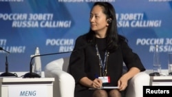 FILE - Meng Wanzhou, chief financial officer of Chinese technology giant Huawei, attends a session of the VTB Capital Investment Forum "Russia Calling!" in Moscow, Russia Oct. 2, 2014. 