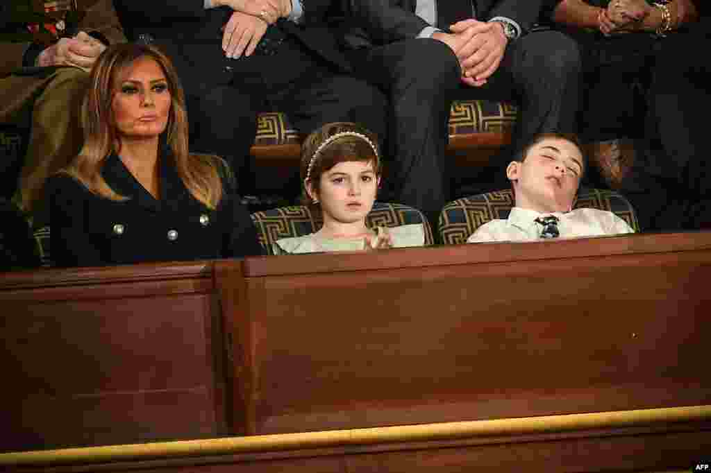 Special guest Joshua Trump falls asleep while U.S. First lady Melania Trump (L) and special guest Grace Eline listen to the State of the Union address at the U.S. Capitol in Washington, D.C., Feb. 5, 2019. Joshua is a sixth-grade student from Wilmington, Delaware, who has been bullied over his last name. 